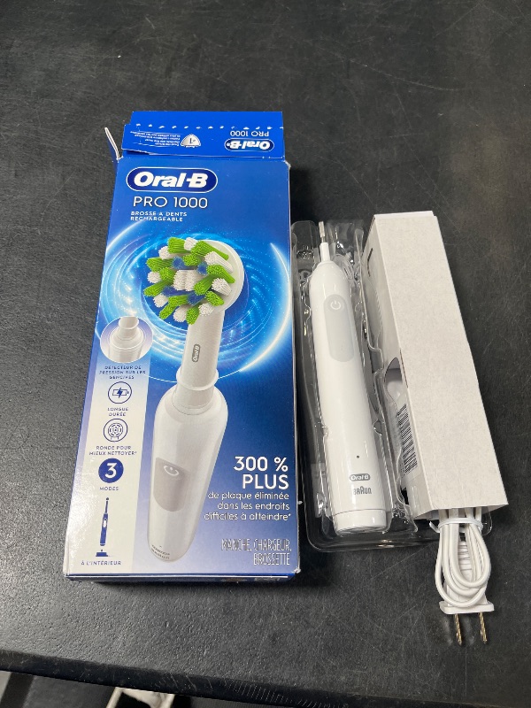Photo 1 of Oral-B Pro 1000 Rechargeable Electric Toothbrush, White
