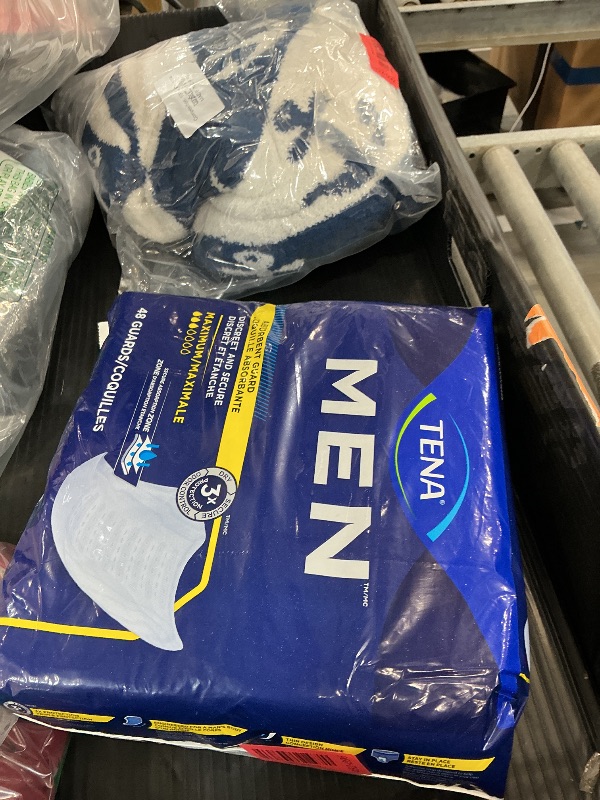 Photo 1 of TENA Men Maximum Guards - 48 Count