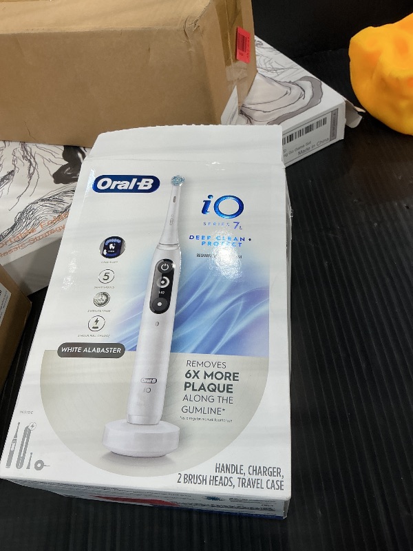 Photo 1 of Oral-B Rechargeable Electric Toothbrush, iO7 Limited Deep Clean + Protect, 5 Cleaning Modes, Interactive Display, Visible Pressure Sensor, 2 Brush Heads, Charging Travel Case, White