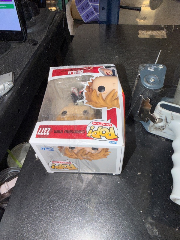 Photo 1 of Funko POP! Chainsaw Man Denji Reading Vinyl Figure