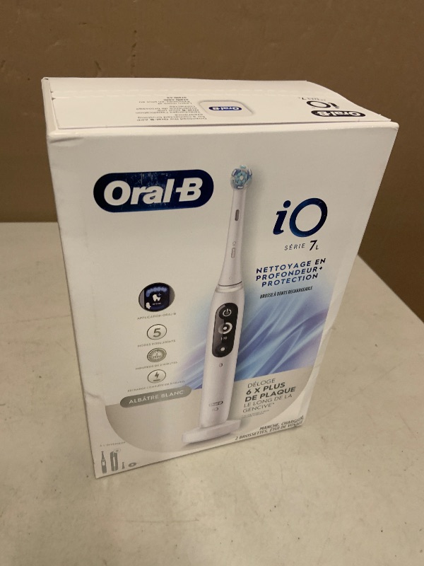 Photo 1 of Oral-B Rechargeable Electric Toothbrush, iO7 Limited Deep Clean + Protect, 5 Cleaning Modes, Interactive Display, Visible Pressure Sensor, 2 Brush Heads, Charging Travel Case, White