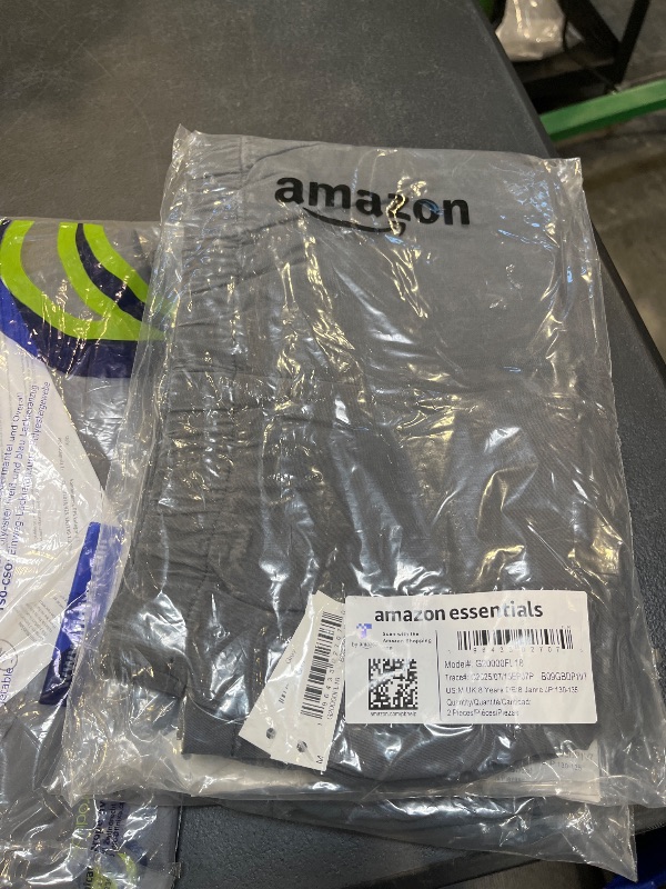 Photo 1 of Amazon Essentials Girls' Pleated Uniform Skorts with Built-in Shorts, Pull-on, Stretchy, Pack of 2, Grey, Medium