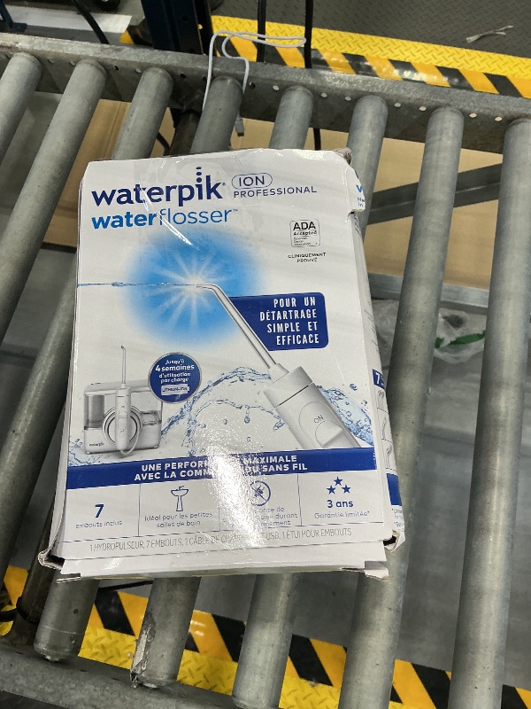Photo 1 of Waterpik ION Rechargeable Water Flosser with 10 Settings, 7 Tips, White