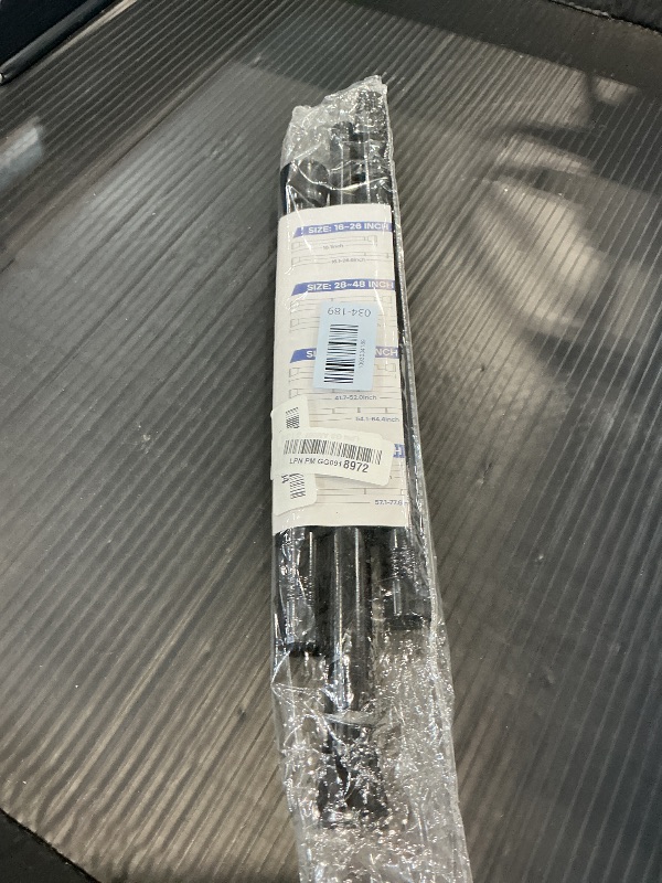 Photo 1 of MEXAU Black Spring Tension Curtain Rod 28-52 Inches