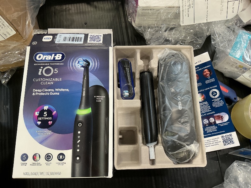 Photo 1 of Oral-B Rechargeable Electric Toothbrush, iO5 Customizable Clean, 5 Cleaning Modes, Visual Pressure Sensor to Protect Gums, Travel Case, Black