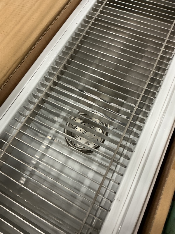 View 2 of metal grate sink drain
