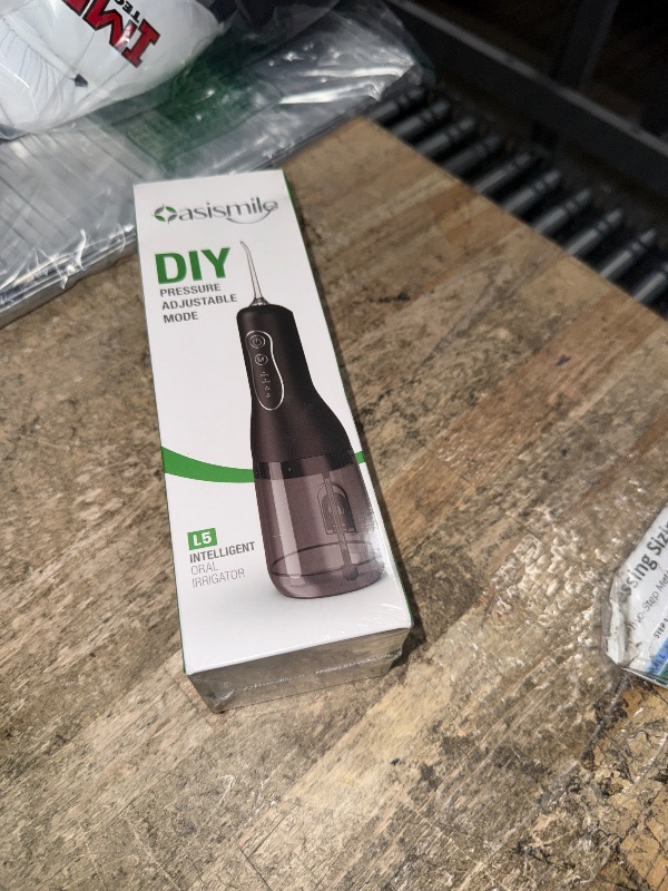 View 2 of ***Factory sealed**** OasiSmile L5 Cordless Water Flosser, Black, Adjustable Pressure