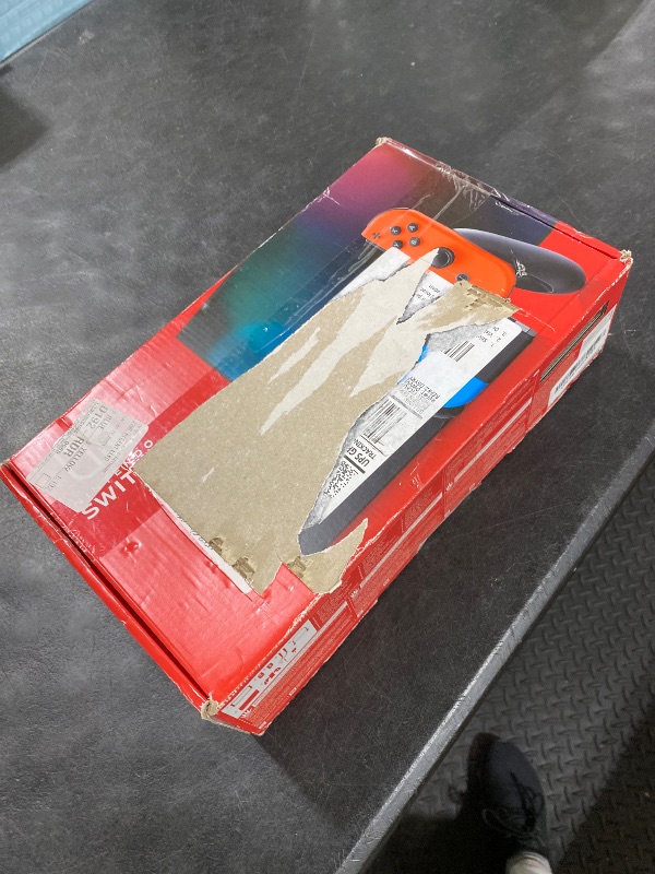 Photo 1 of Nintendo Switch Console with Neon Blue and Red Joy-Con