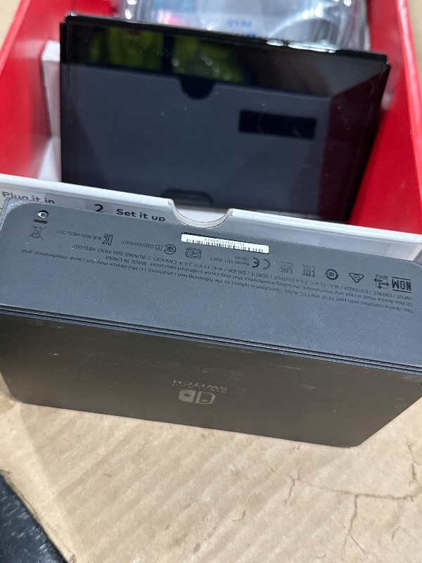 View 3 of Nintendo Switch OLED Model with Neon Red & Blue Joy-Con