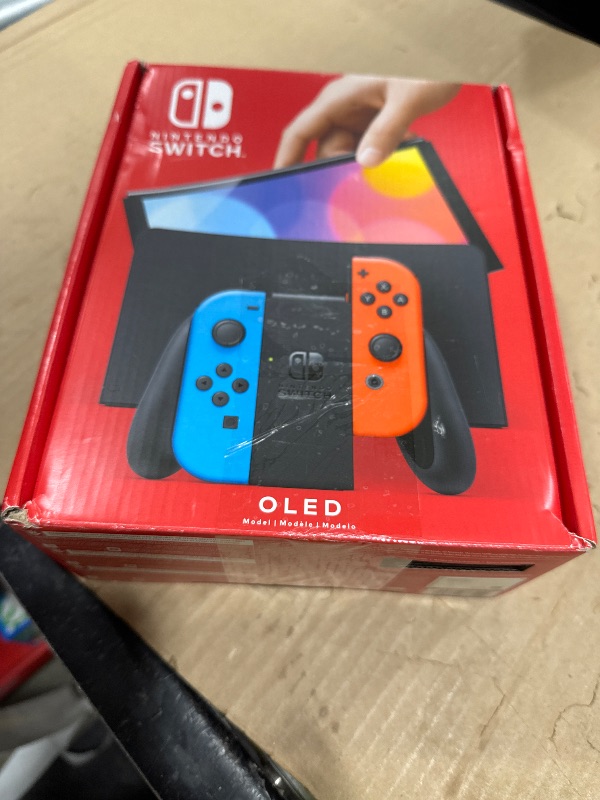 View 6 of Nintendo Switch OLED Model with Neon Red & Blue Joy-Con
