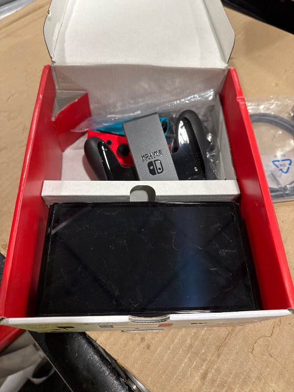 View 5 of Nintendo Switch OLED Model with Neon Red & Blue Joy-Con