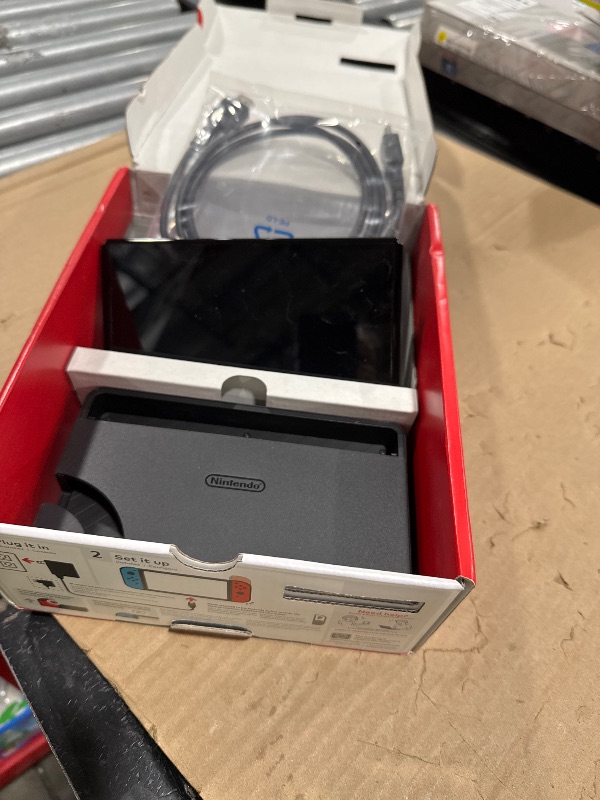 View 2 of Nintendo Switch OLED Model with Neon Red & Blue Joy-Con