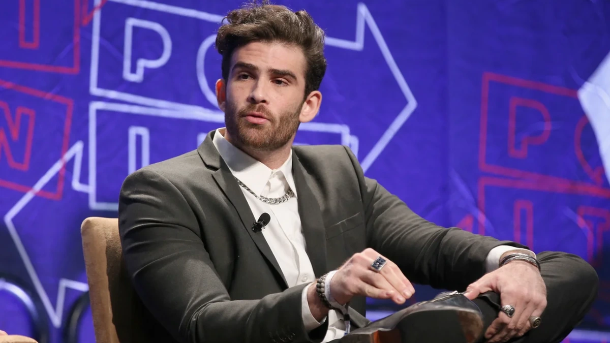 US political commentator speaking at a public media event