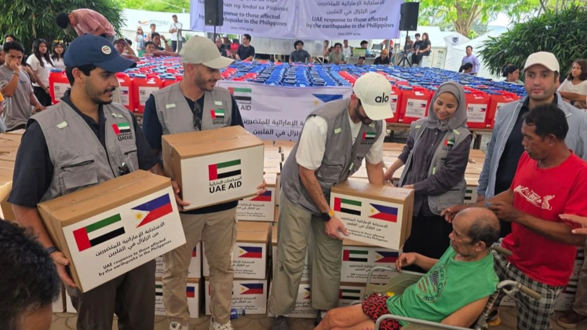 UAE aid team distributing parcels and water to earthquake-affected families in the Philippines