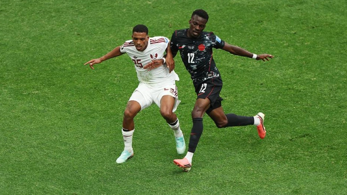 Football players challenging for the ball during a FIFA World Cup match