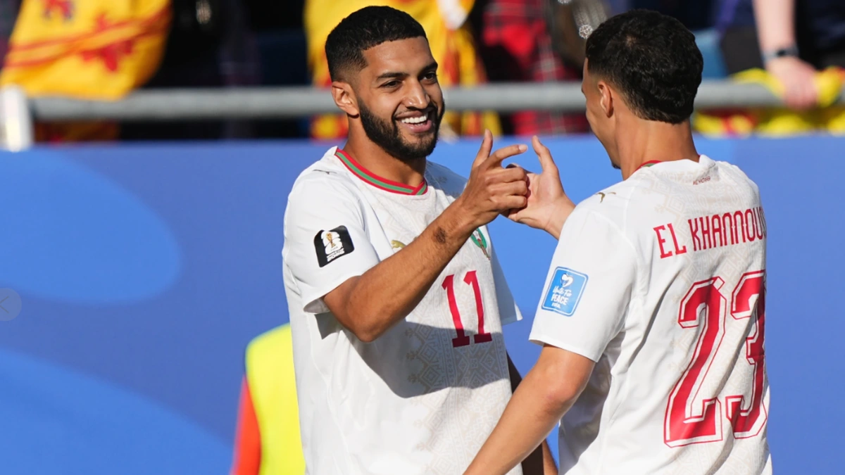 Morocco players celebrating during FIFA World Cup match against Scotland