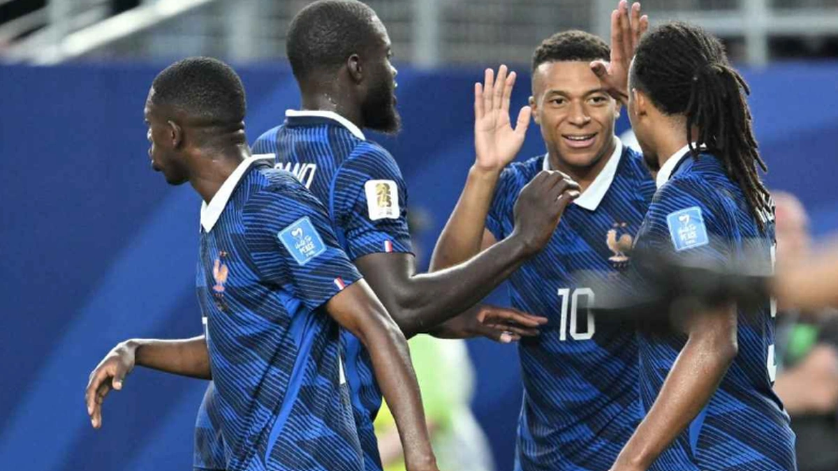 France players including Kylian Mbappe celebrating during a World Cup match