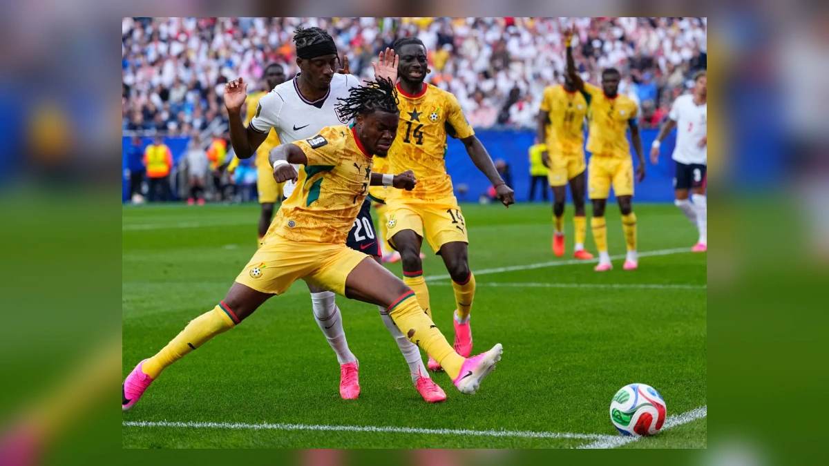 Ghana and England players battling for the ball during a World Cup match