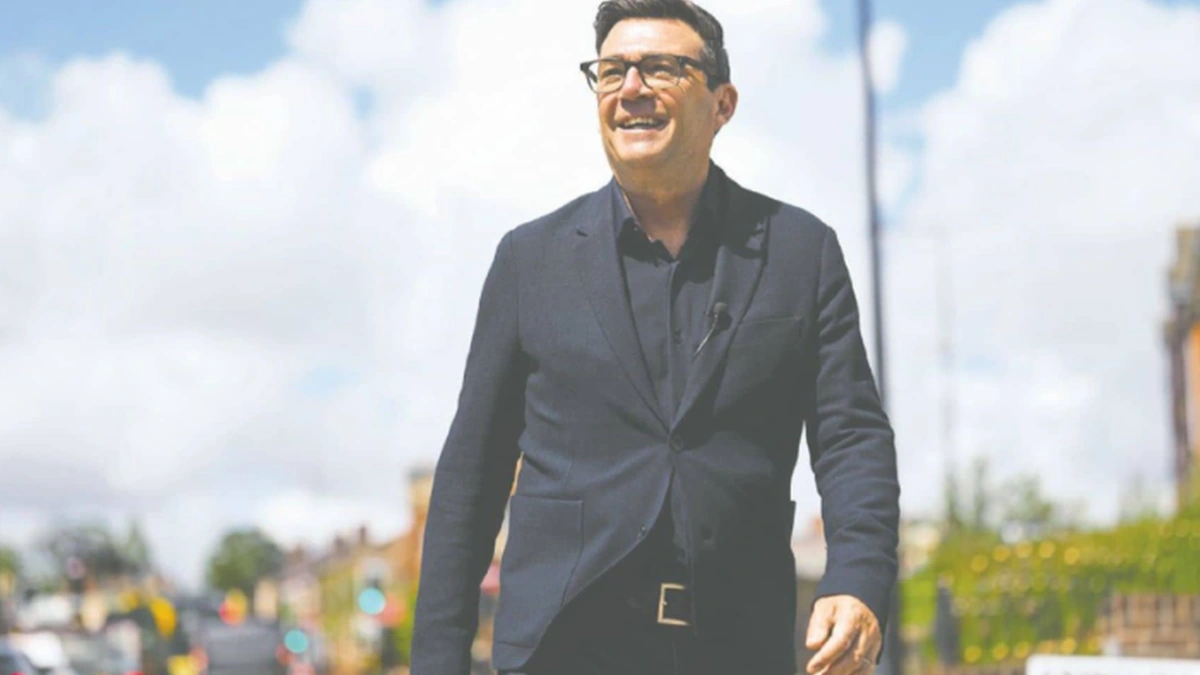 Andy Burnham walking outdoors as Labour leadership speculation grows in Britain