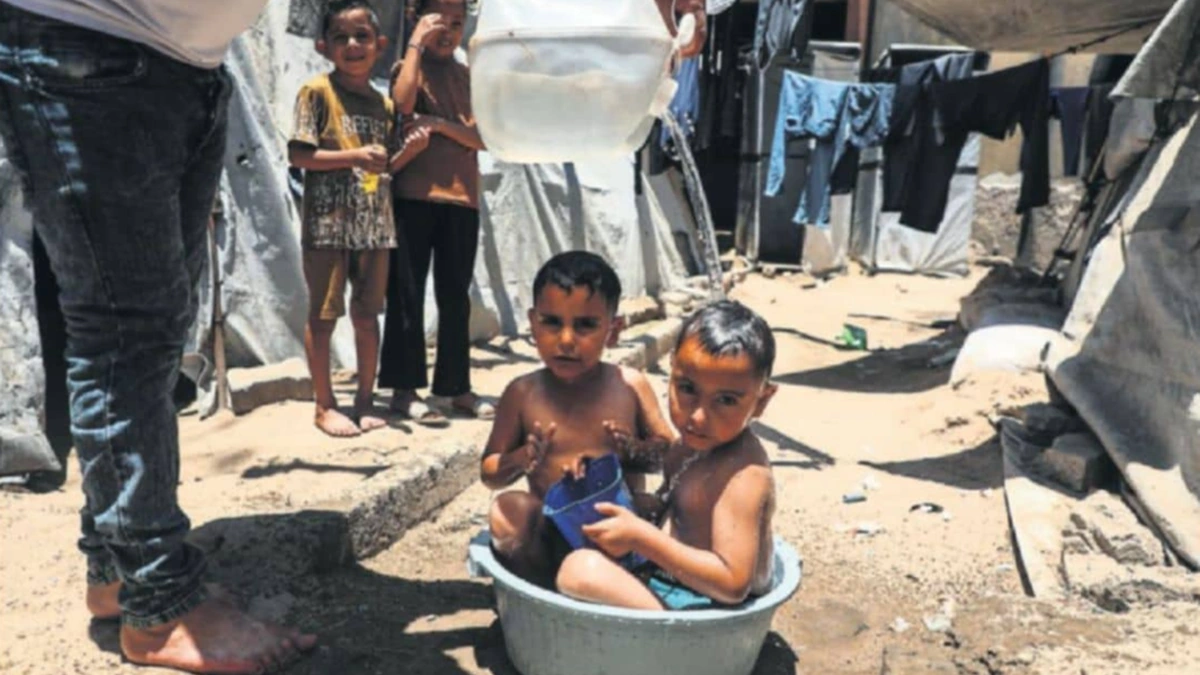 Palestinian children in a Gaza displacement camp amid UN inquiry findings