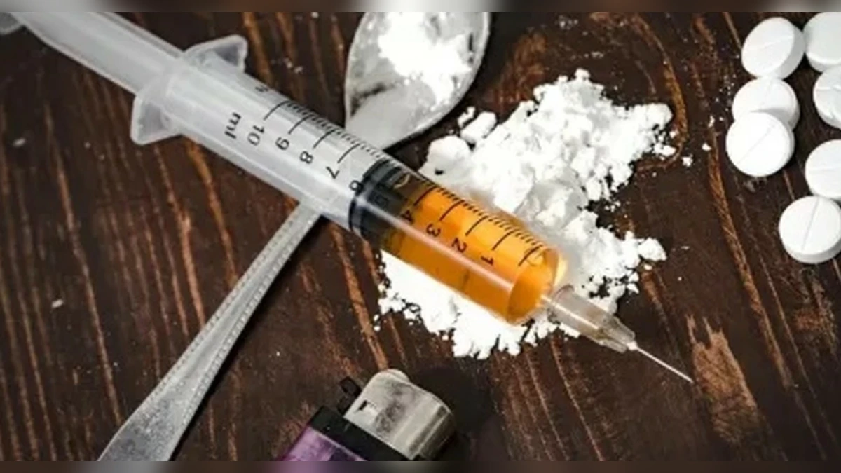 Drug awareness image with syringe and tablets