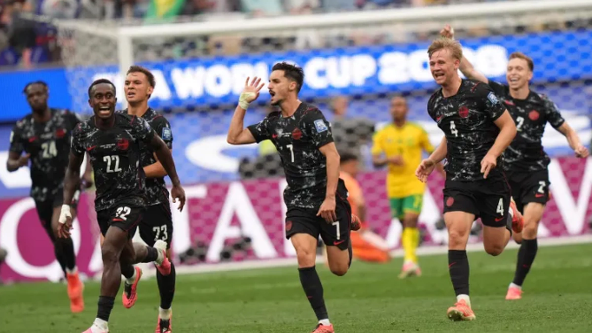 Canada football players celebrating World Cup victory over South Africa