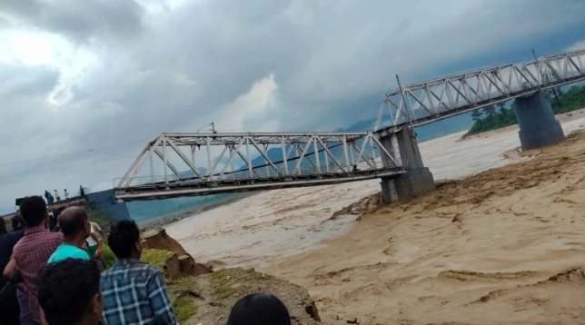 Collapsed railway bridge over floodwaters in Assam