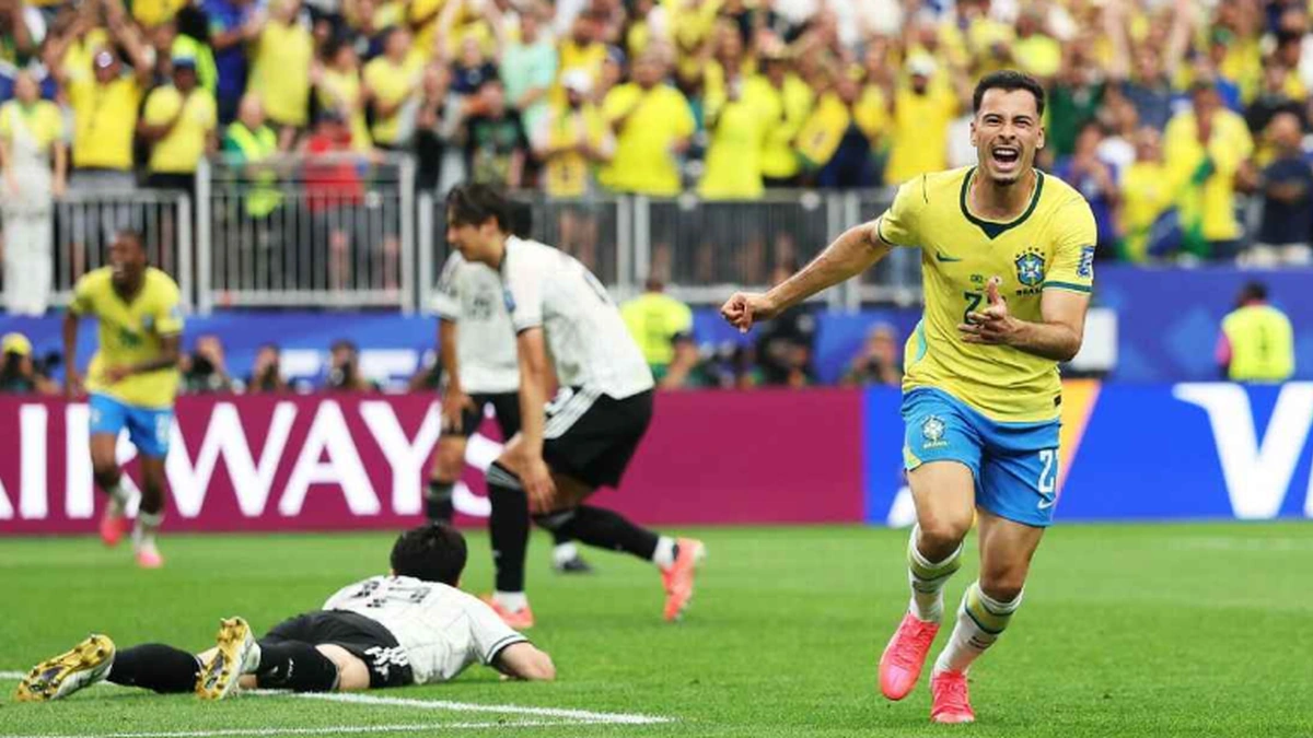 Brazil player celebrating after late World Cup goal against Japan