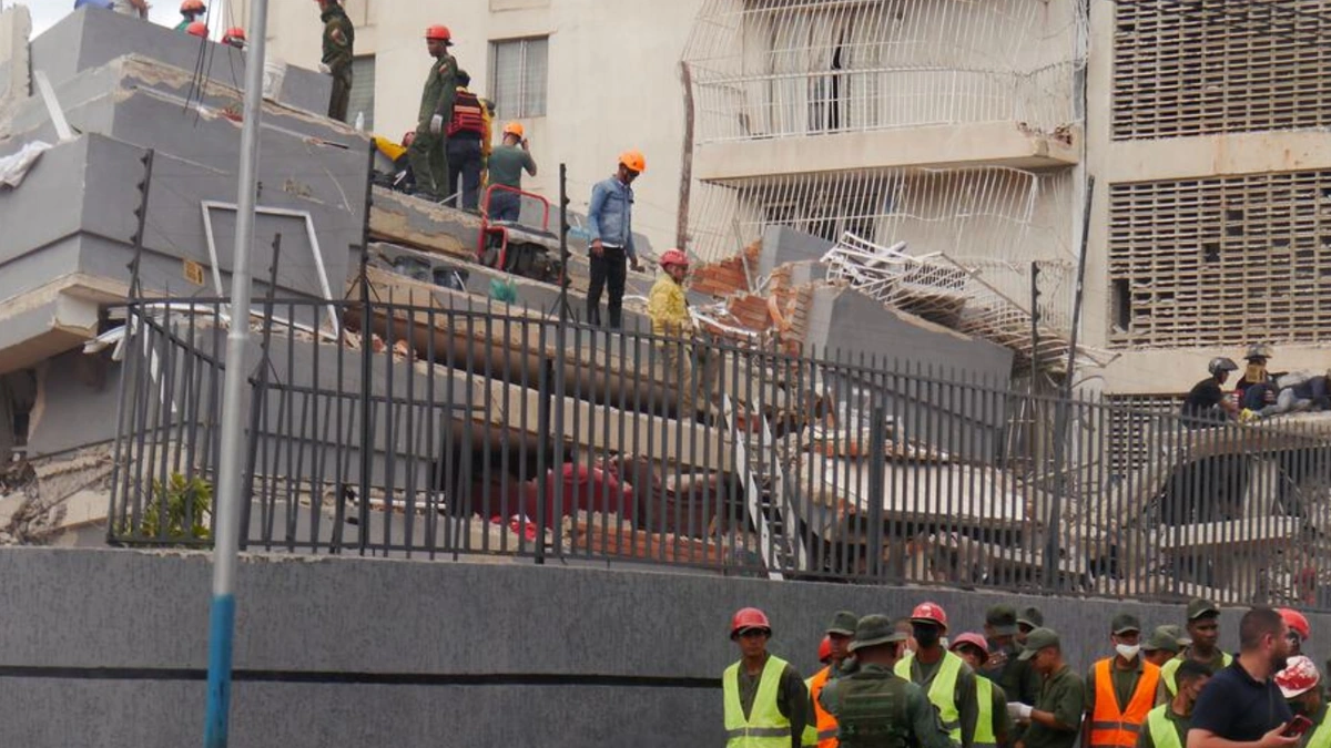 Rescue workers searching collapsed buildings after Venezuela earthquakes