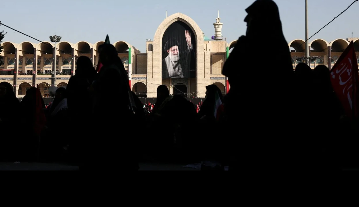 Crowds gathered in Tehran beneath a large portrait of Ali Khamenei