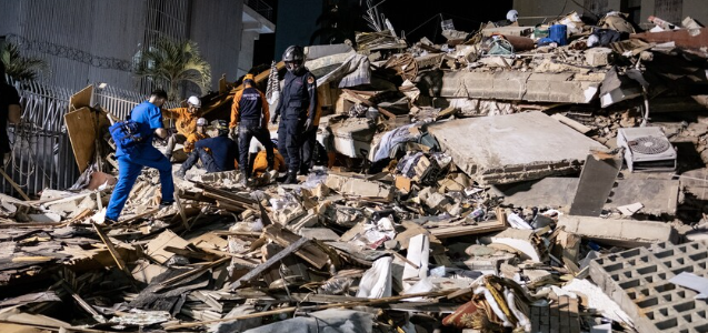 Illustration of rescue workers searching rubble after powerful Venezuela earthquakes