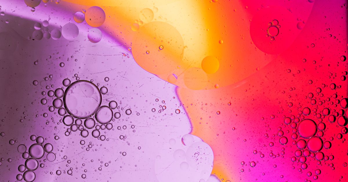 Vibrant abstract of bubbles in liquid with vivid colors and textures.