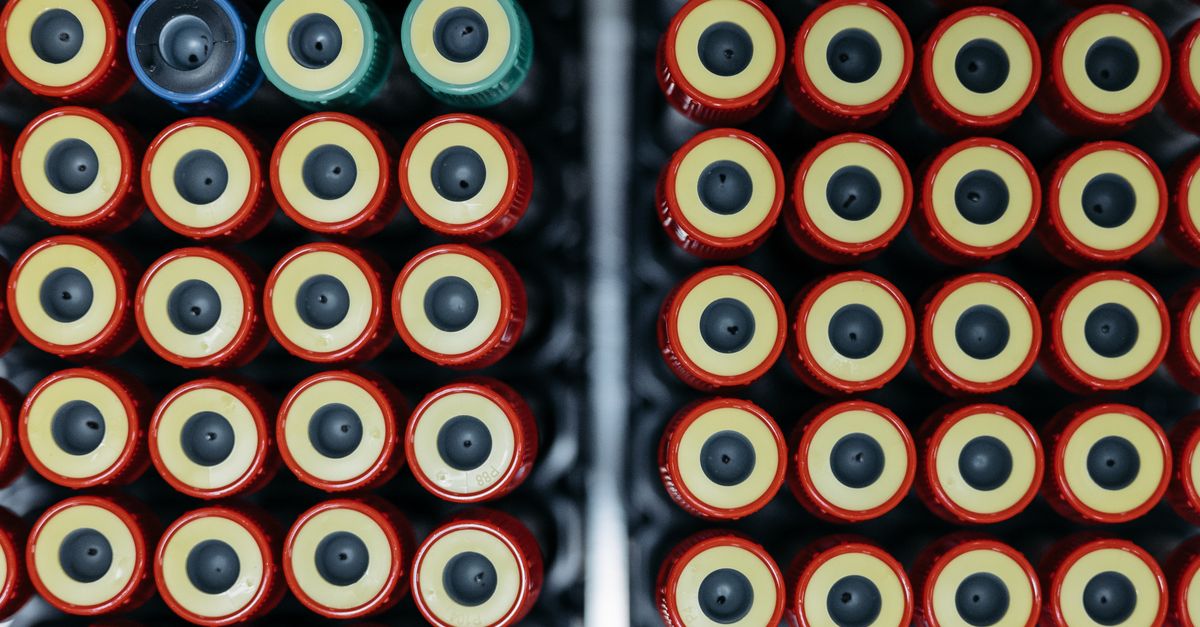 Array of capped laboratory test tubes in a clinical setting.