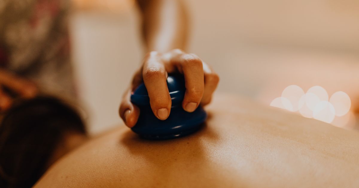 Close-up of cupping therapy on a person's back, focusing on relaxation and wellness.