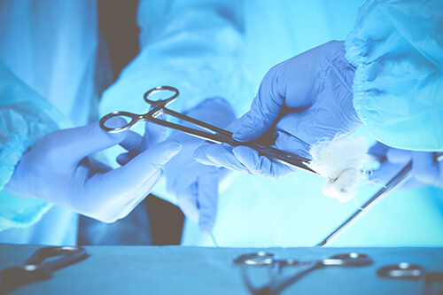 pictorial representation of doctors sharing equipment of surgical procedure