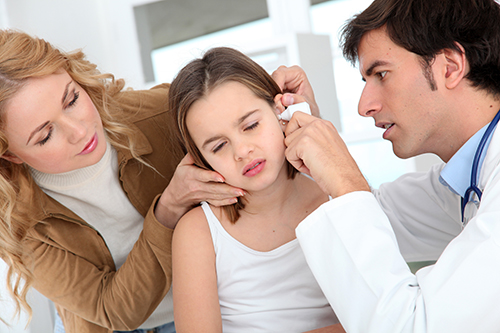 an ENT specialist diagnosing the ear infection