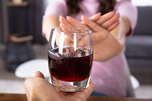 woman saying no to alcohol