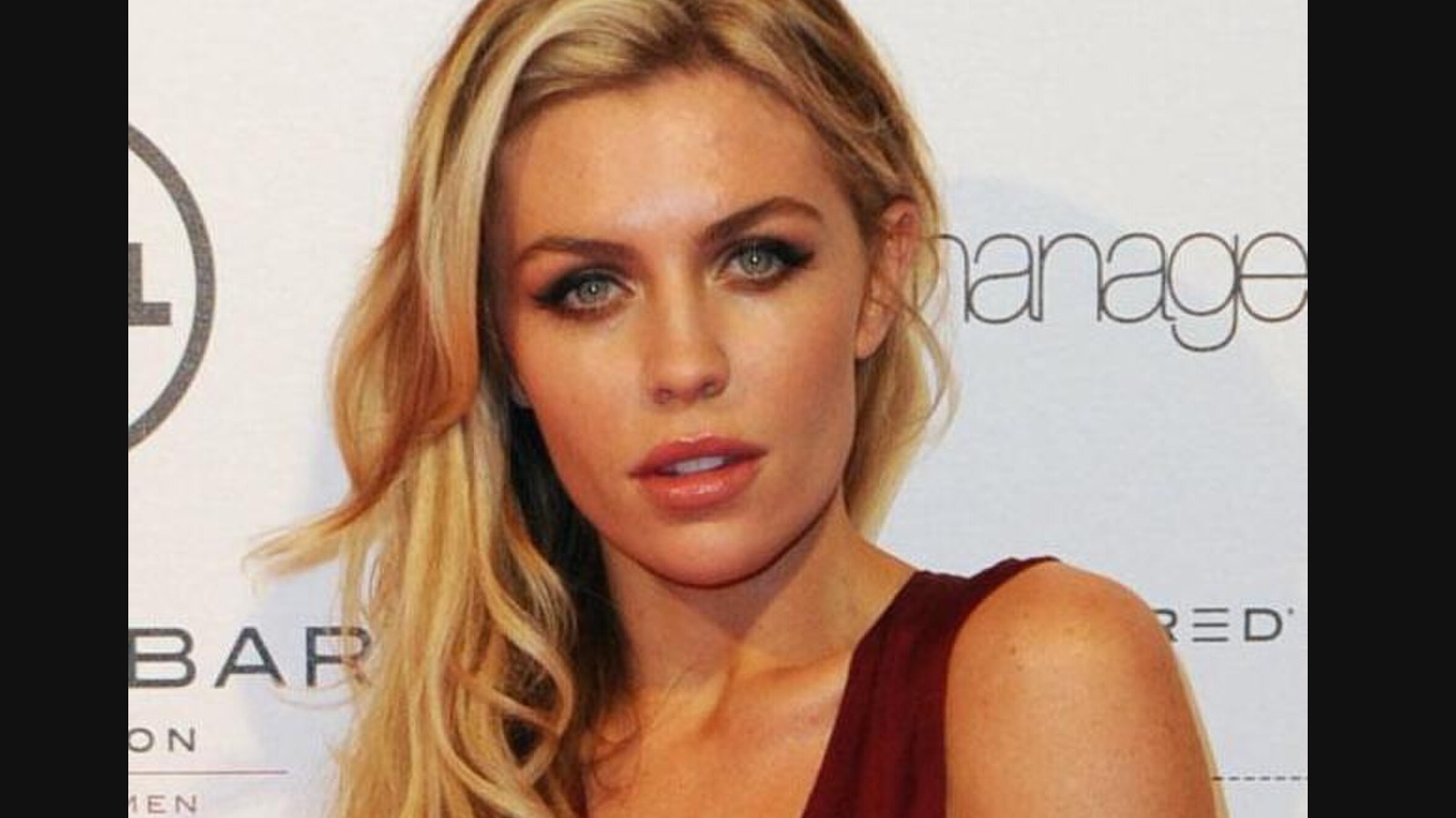 Abbey Clancy, 40, shares beach kiss with husband Peter Crouch on holiday