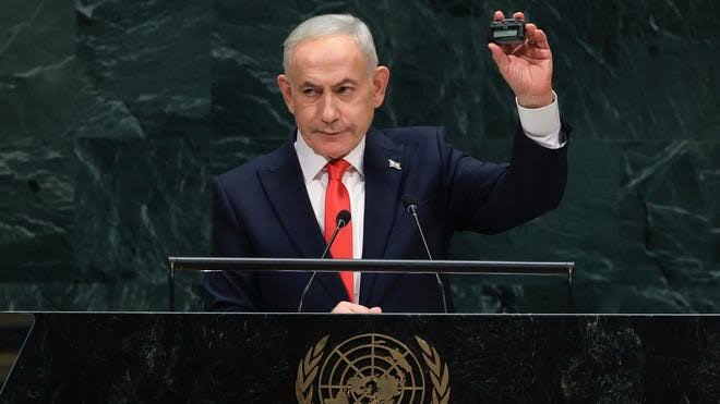 Netanyahu holds up a pager at UN, says Hezbollah remembers