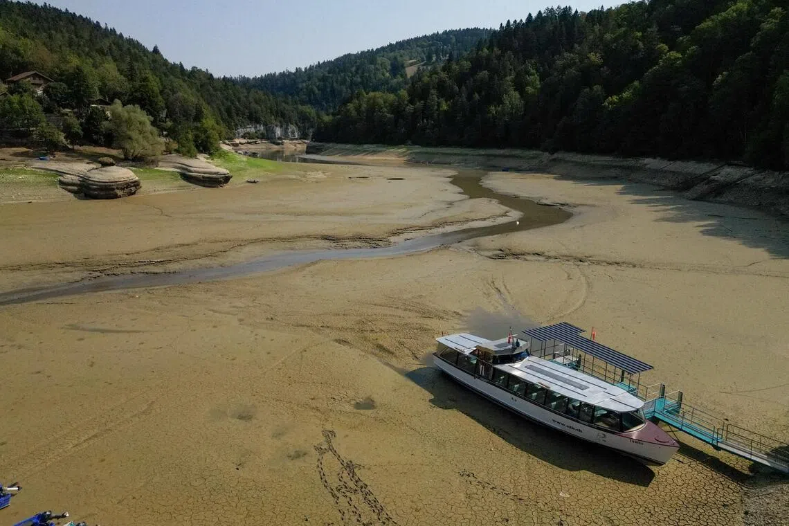 Drought leaves Swiss border lake popular with tourists all but drained