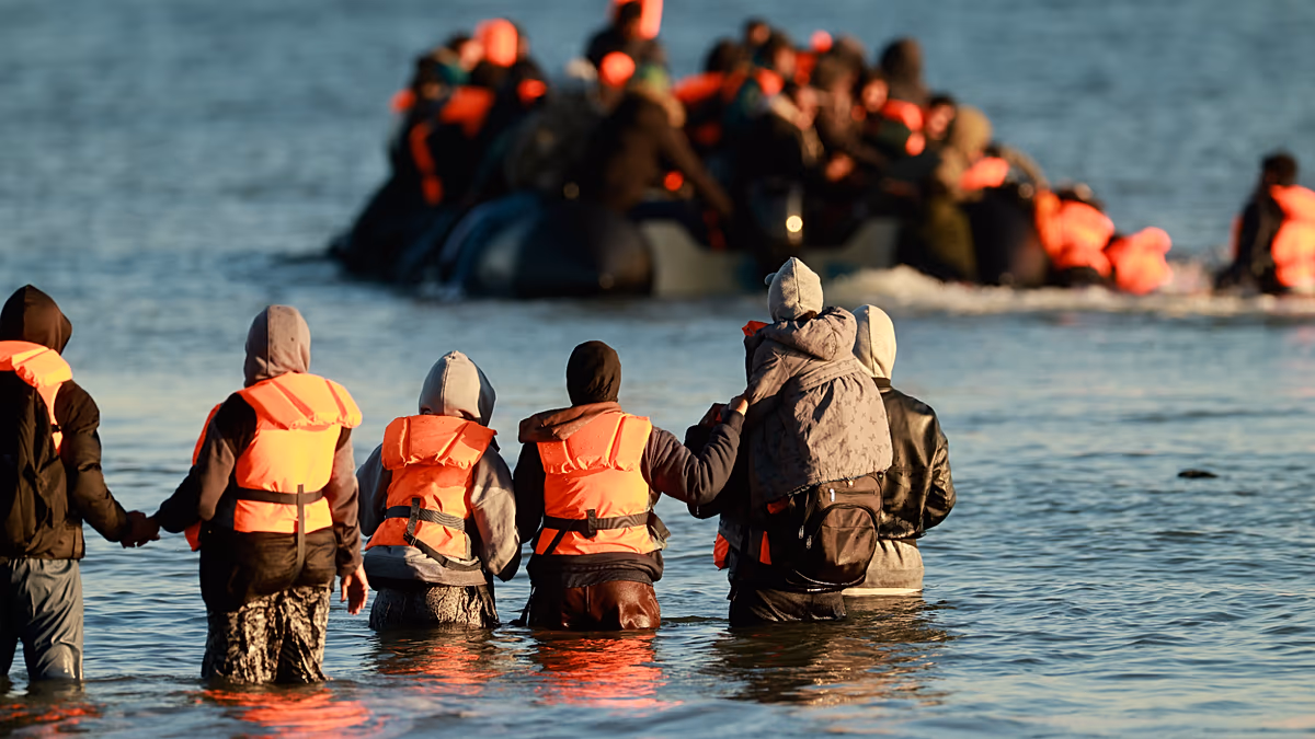 France migrants board overloaded boat for UK Channel crossing