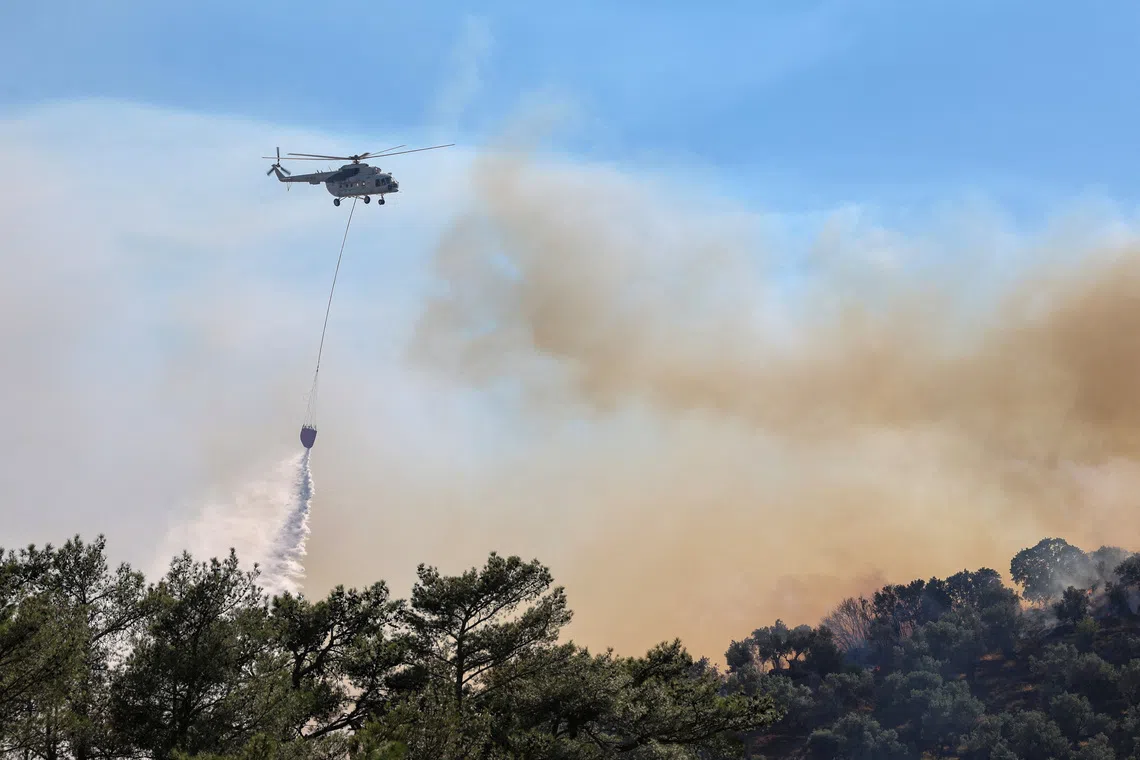 Greek firefighters battle deadly wildfires on Crete for a second day
