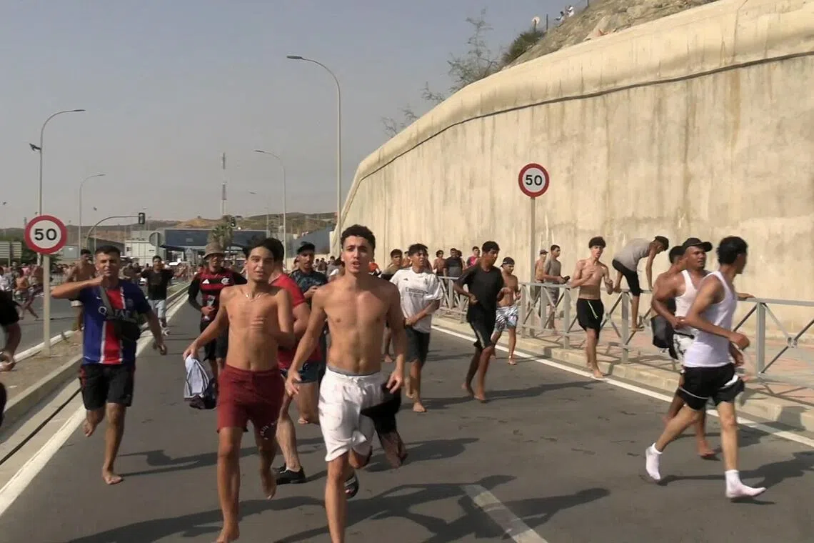 Military called in as migrants pour into Spain’s North African enclave from Morocco