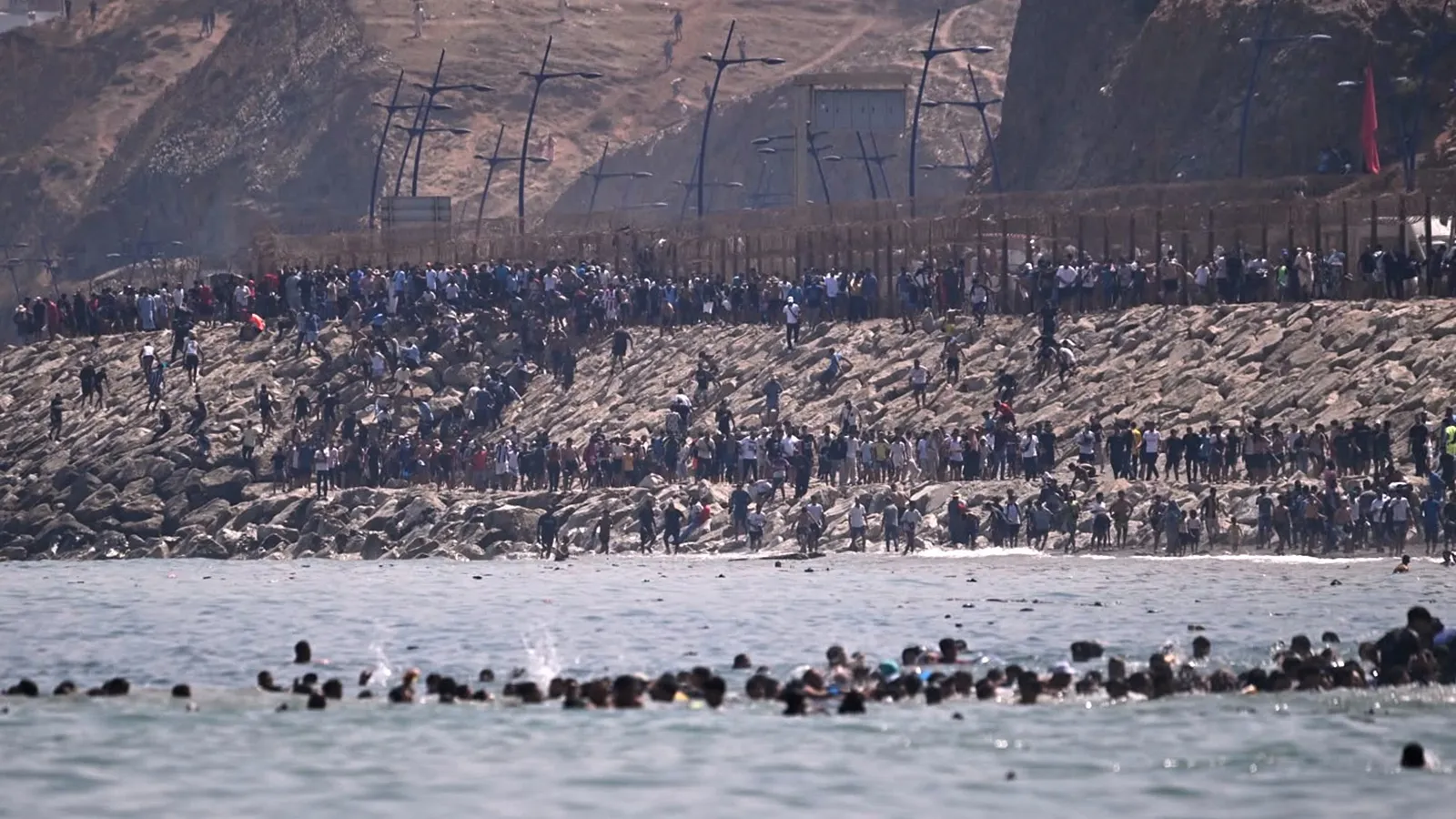Watch: Thousands swim into Spain’s Ceuta from Morocco. Why the border collapsed today