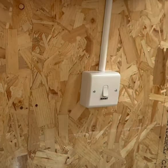 Installed on a workshop wall to neatly house power and data cables alongside sockets.