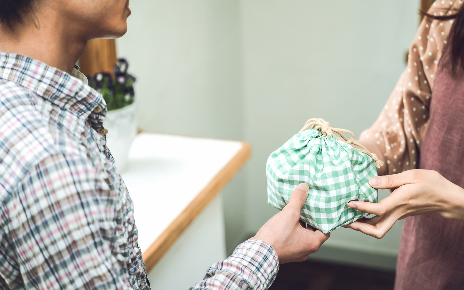 Show your gratitude by receiving items with two hands.