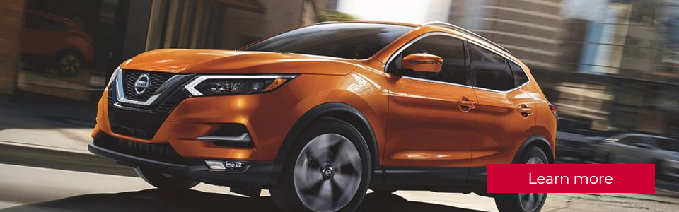 Learn more: Image of an orange Nissan Qashqai SUV in the city and in motion