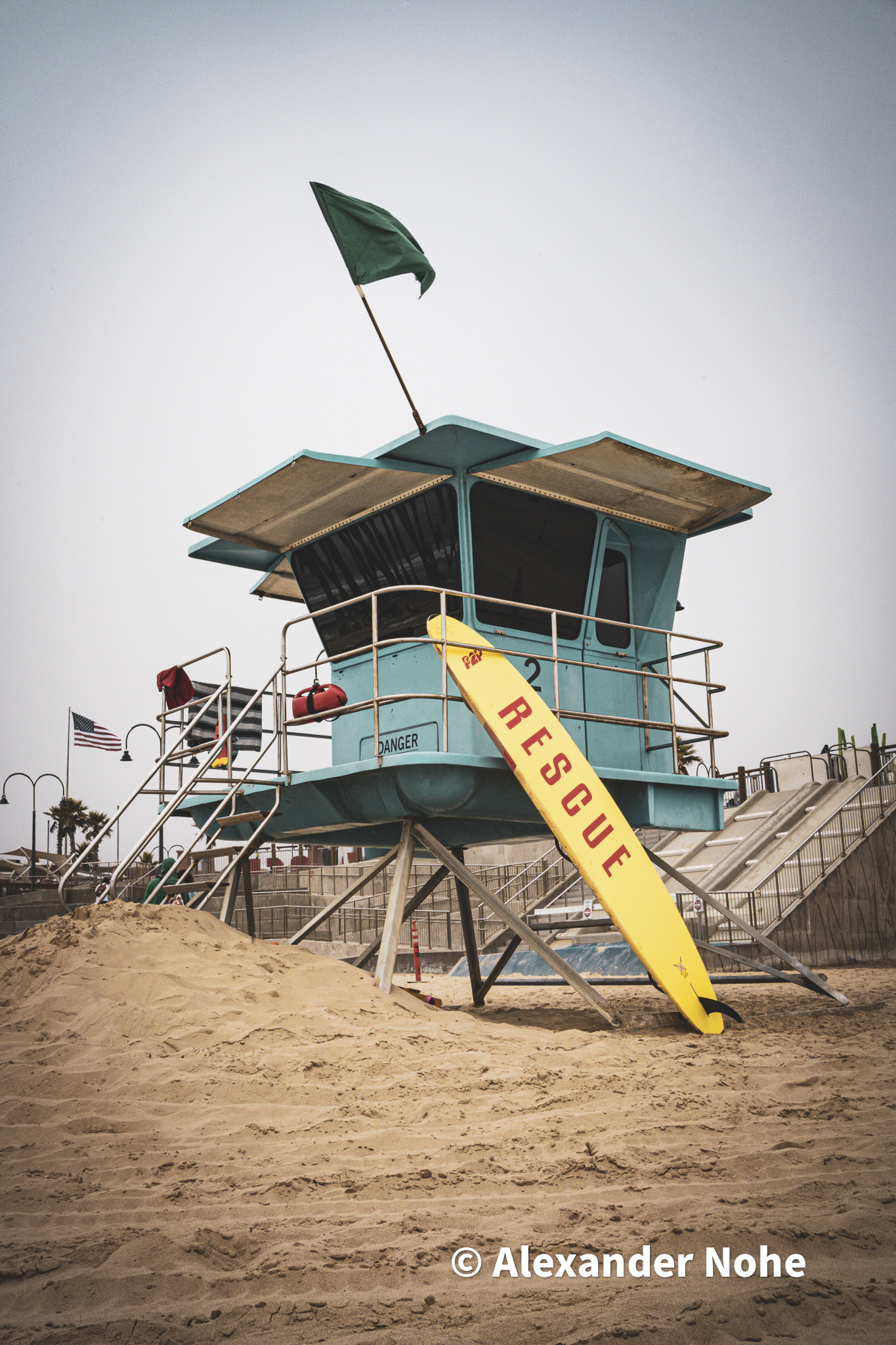 Light blue lifeguard tower on a sandy beach
