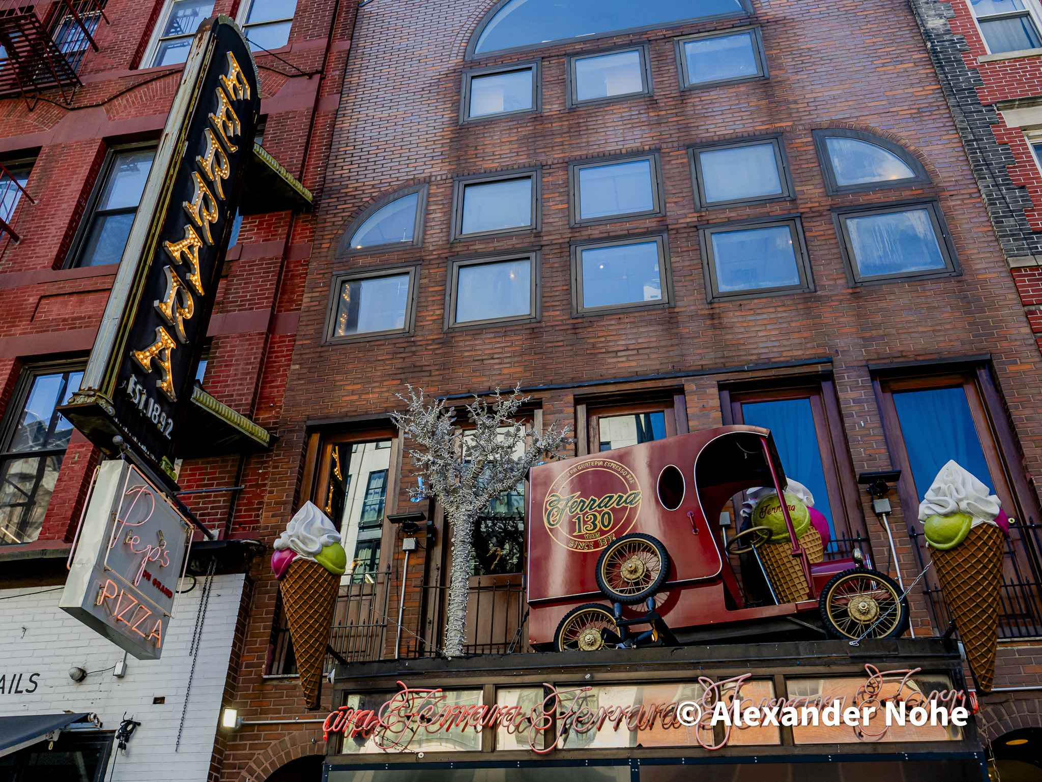 Ferrara Bakery marquee and vintage red delivery truck