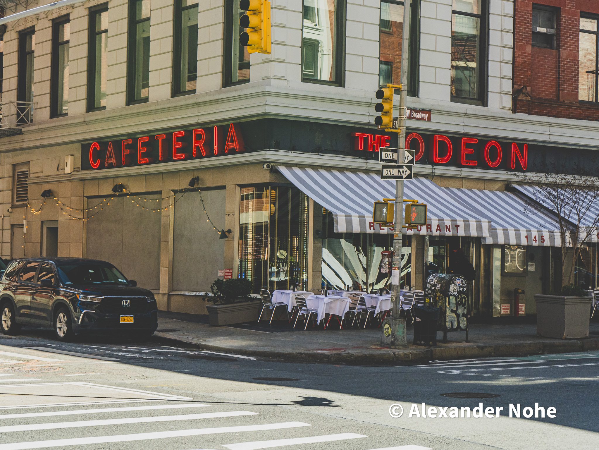 The Odeon restaurant with red neon signs at night